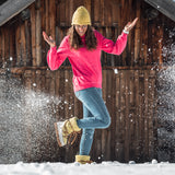 happy woman wearing Après All Day Boots in snow (7266281291960)