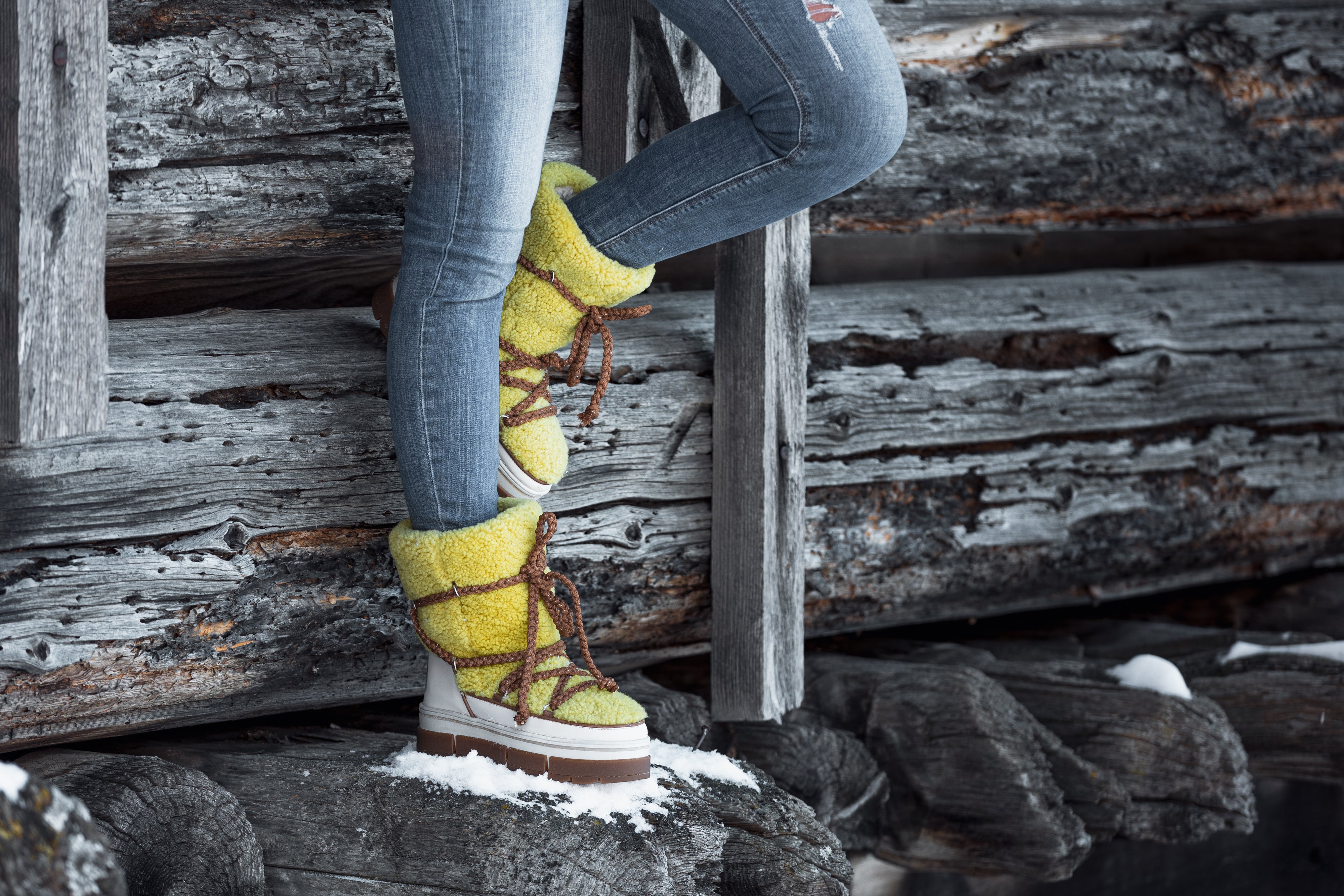 woman wearing yellow Après All Day Boots with jeans (7266281291960)