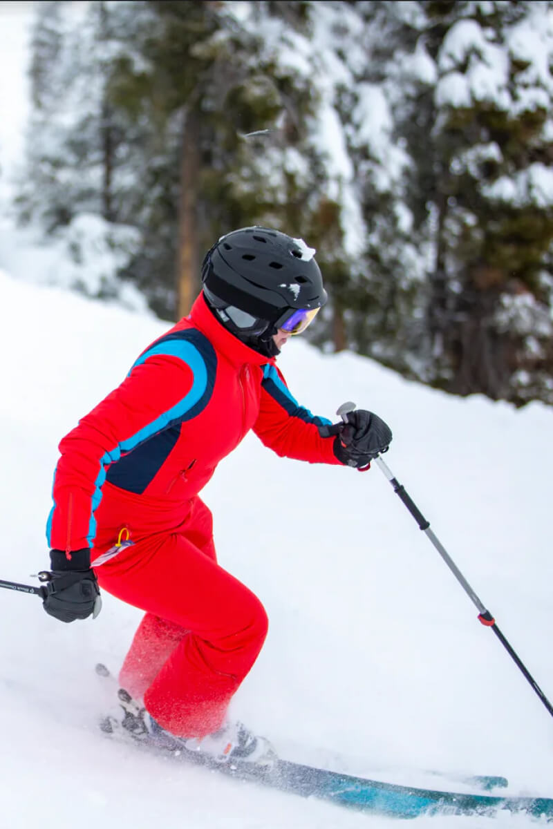 woman skiing designer vintage-inspired ski suit