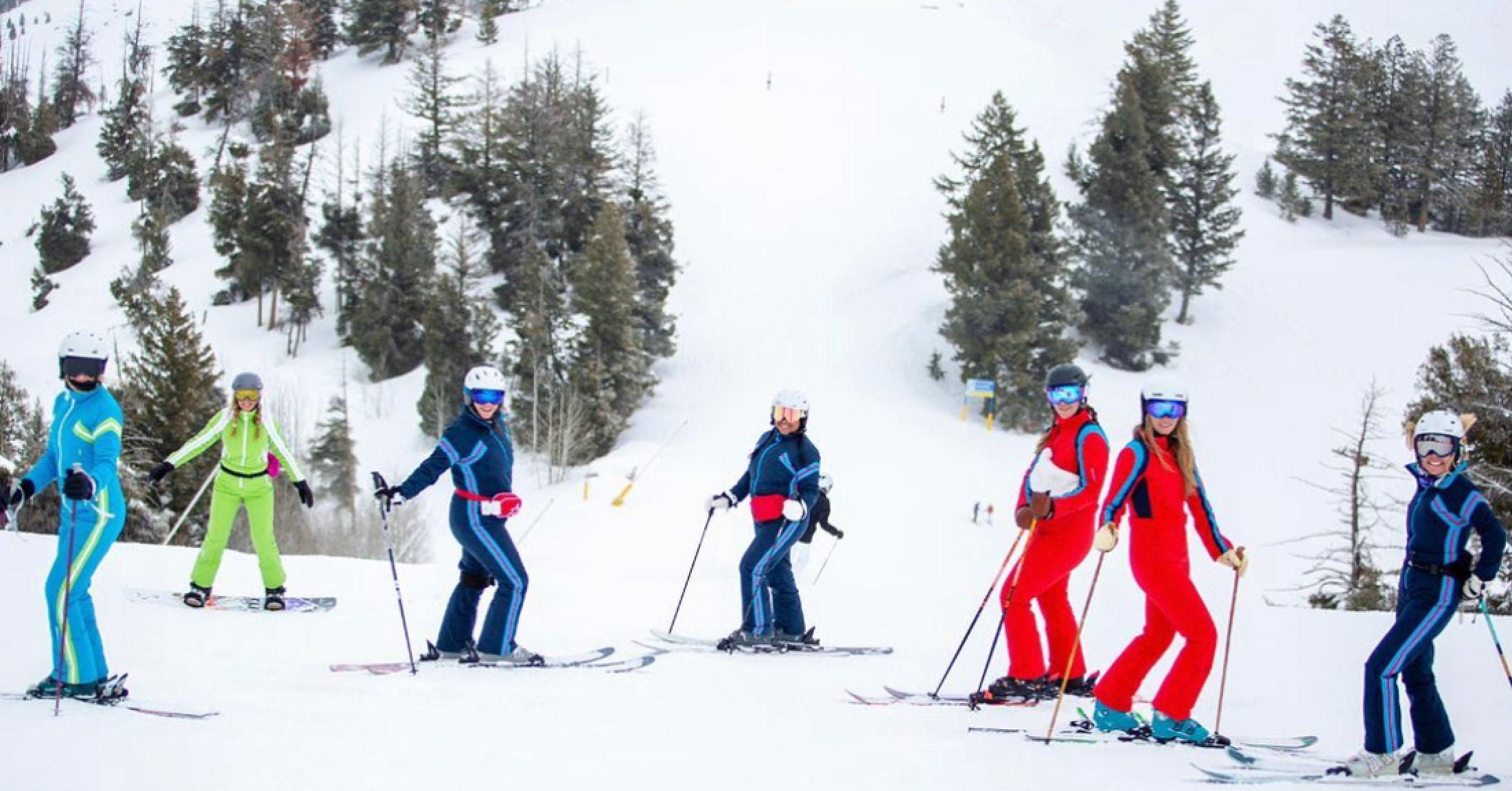 Women skiing in luxury one pieces ski suits at Sun Valley