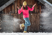 happy woman wearing Après All Day Boots in snow (7266281291960)