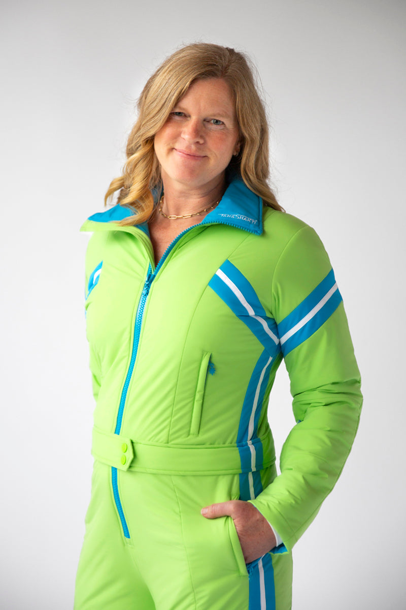 side closeup view model wearing tara shakti one-piece ski suit Alex variant green light blue (7313802461368)