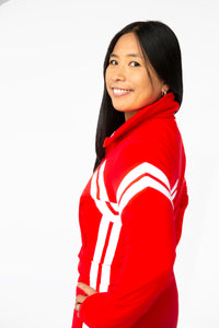 side closeup view model wearing tara shakti one-piece ski suit farrah variant red white (7313799938232)