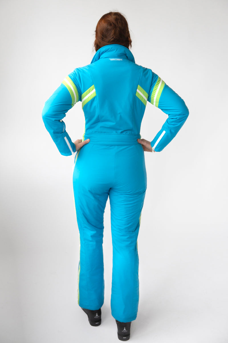 back view model wearing tara shakti one-piece ski suit jackie variant light blue green