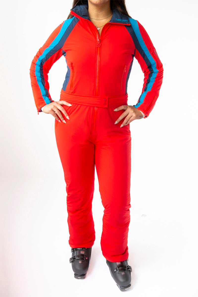 front view model wearing tara shakti one-piece ski suit diana variant red blue