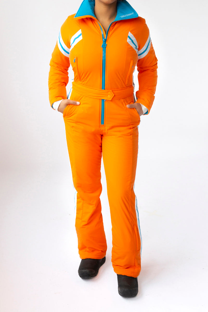 front view model wearing tara shakti one-piece ski suit gloria variant orange white