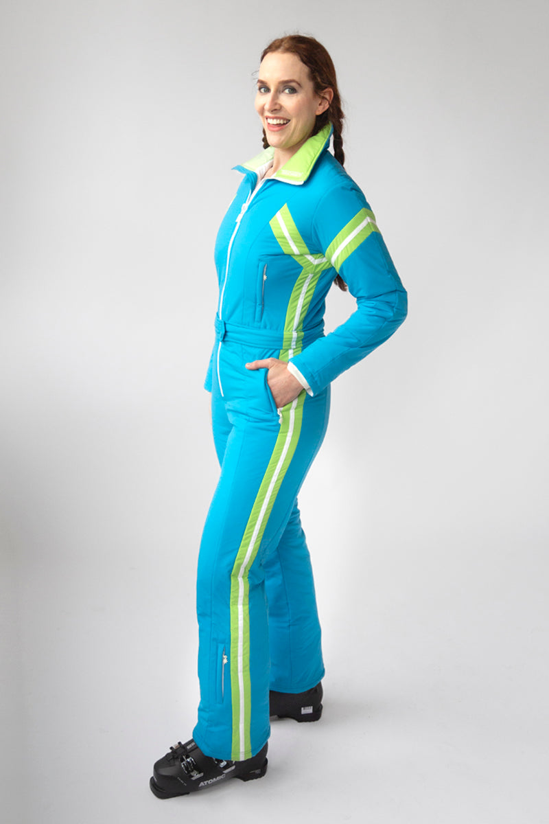 side view model wearing tara shakti one-piece ski suit jackie variant light blue green